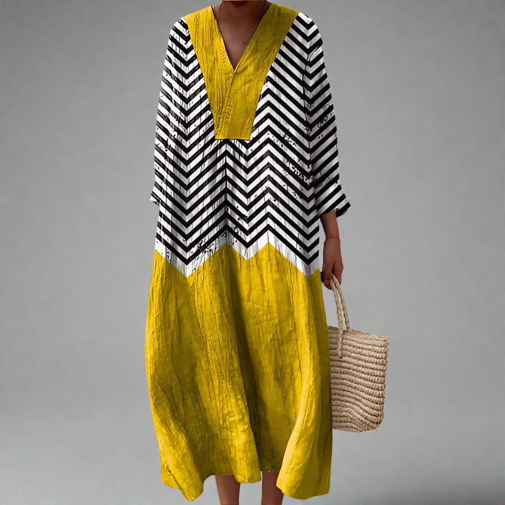 Womens dress featuring a flowing silhouette with a stylish geometric pattern, perfect for both formal occasions and everyday wear. 0