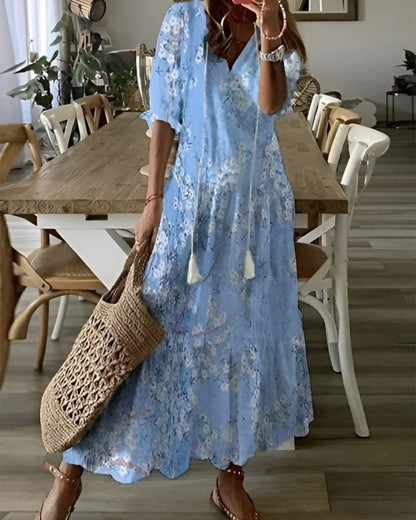 Lightweight summer boho style women's dress featuring a flowy fit and stylish tassel details, perfect for warm weather outings. 3