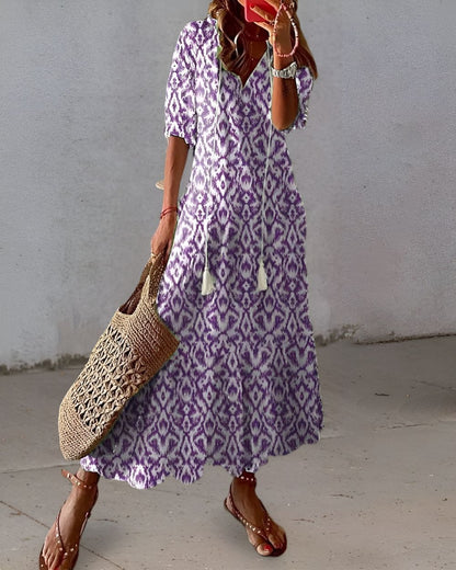 Lightweight summer boho style women's dress featuring a flowy fit and stylish tassel details, perfect for warm weather outings. 2