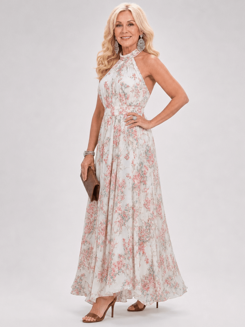 Womens floral print midi dress with halter neckline and flowing skirt, perfect for summer weddings or special occasions. 3