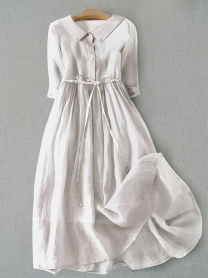 Women's cotton linen blend summer dress featuring a stylish lace-up waist design and elegant half sleeves, perfect for effortless elegance in warm weather. 1