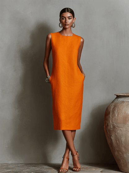 Womens sleeveless dress featuring a minimalist shift design, made from breathable linen fabric, with convenient side pockets for added functionality. 0