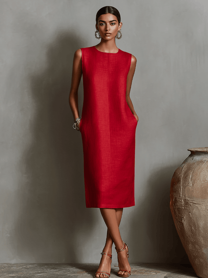 Womens sleeveless dress featuring a minimalist shift design, made from breathable linen fabric, with convenient side pockets for added functionality. 6