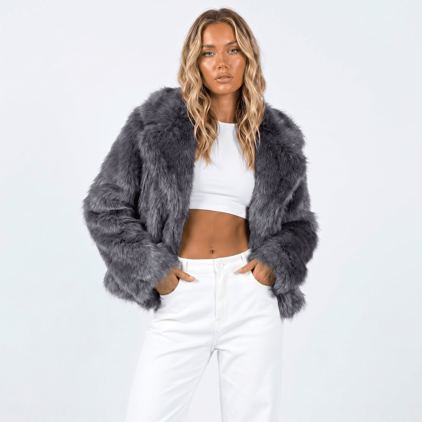 Women's faux fur jacket featuring an oversized collar, designed as a cropped winter coat suitable for casual and evening wear. 2