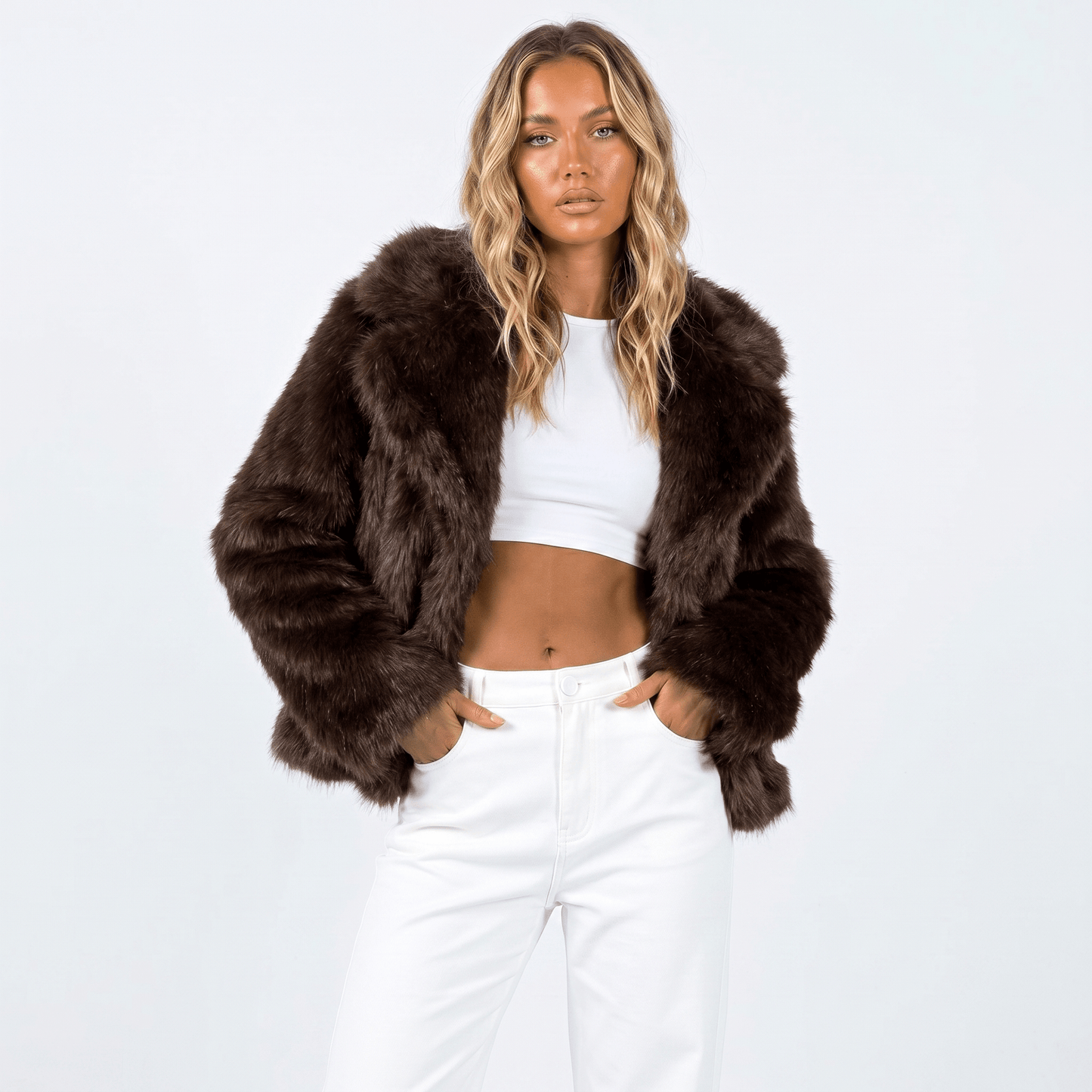 Women's faux fur jacket featuring an oversized collar, designed as a cropped winter coat suitable for casual and evening wear. 6