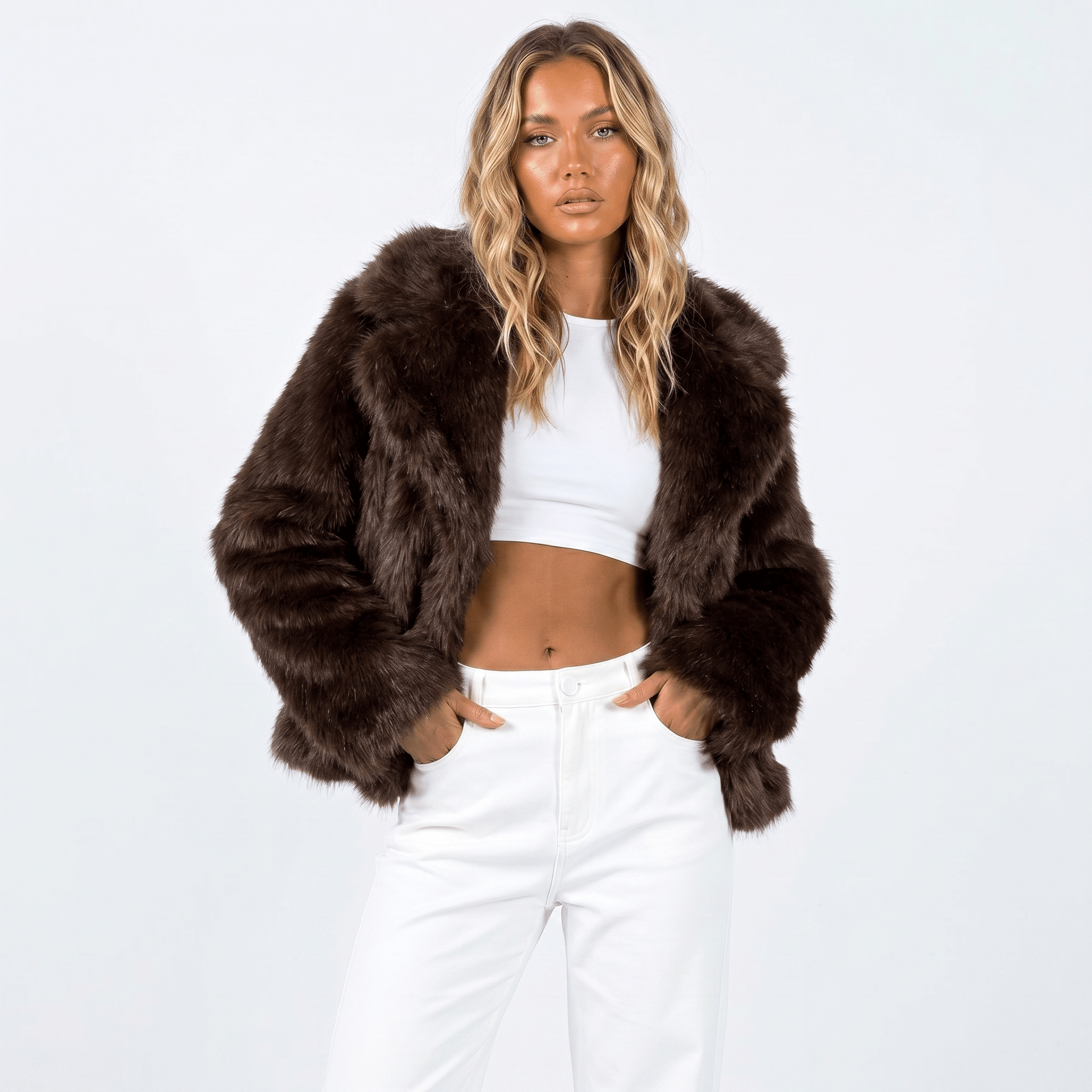 Women's faux fur jacket featuring an oversized collar, designed as a cropped winter coat suitable for casual and evening wear. 6