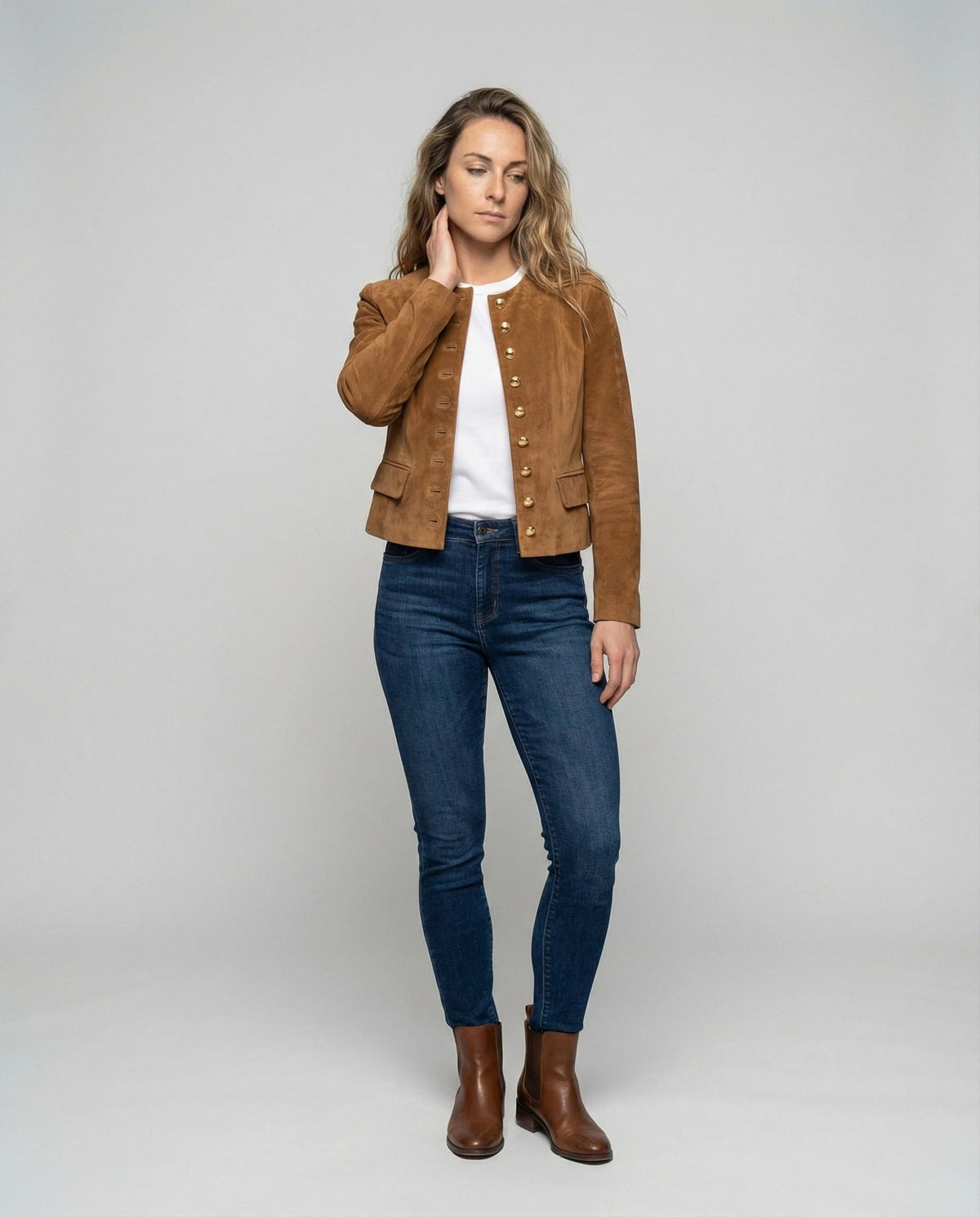 Women's faux suede jacket featuring a collarless cropped design and elegant gold buttons, perfect for a smart casual look. 1
