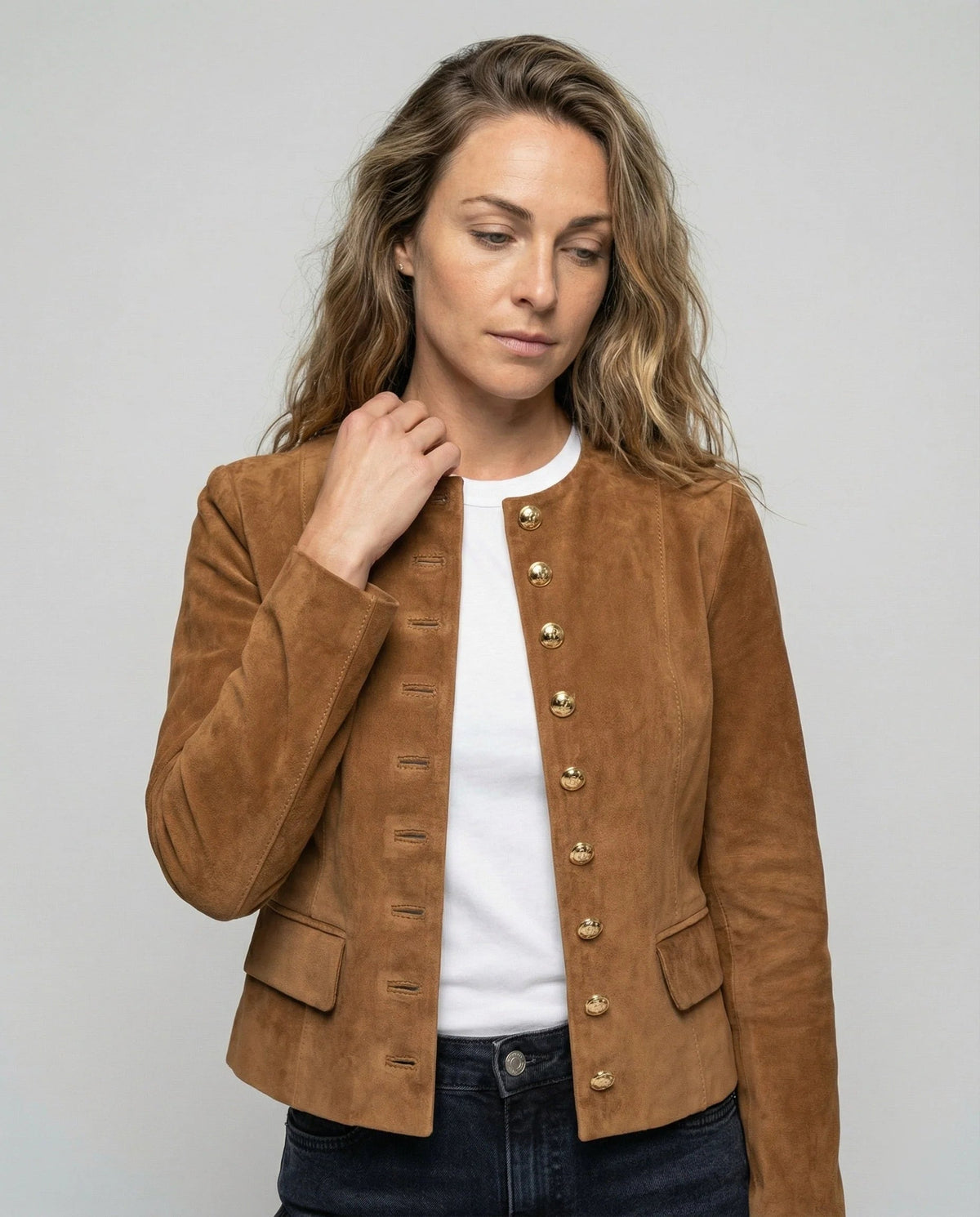Women's faux suede jacket featuring a collarless cropped design and elegant gold buttons, perfect for a smart casual look. 0