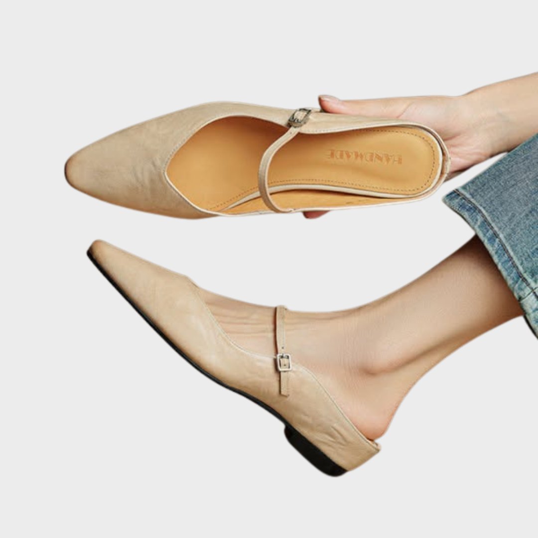 Women's black leather flats featuring a buckle strap and pointed-toe slip-on Mary Jane design, perfect for stylish and comfortable everyday wear. 0