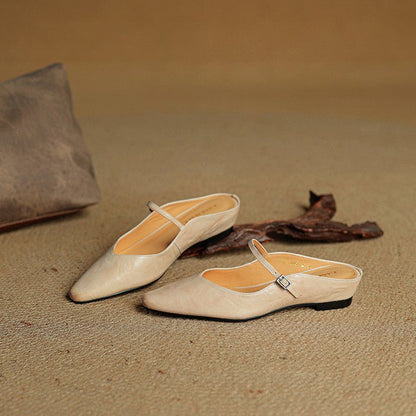 Women's black leather flats featuring a buckle strap and pointed-toe slip-on Mary Jane design, perfect for stylish and comfortable everyday wear. 7