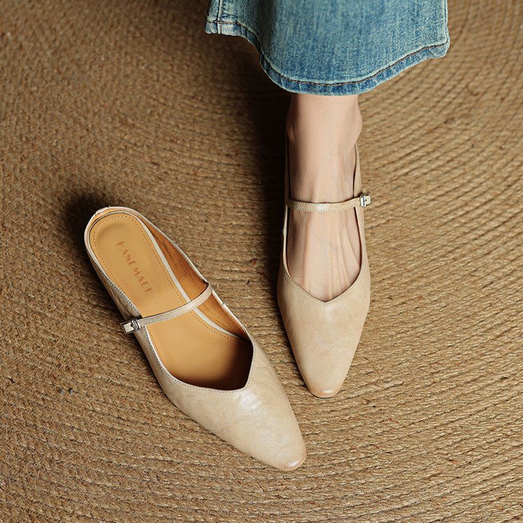 Women's black leather flats featuring a buckle strap and pointed-toe slip-on Mary Jane design, perfect for stylish and comfortable everyday wear. 4