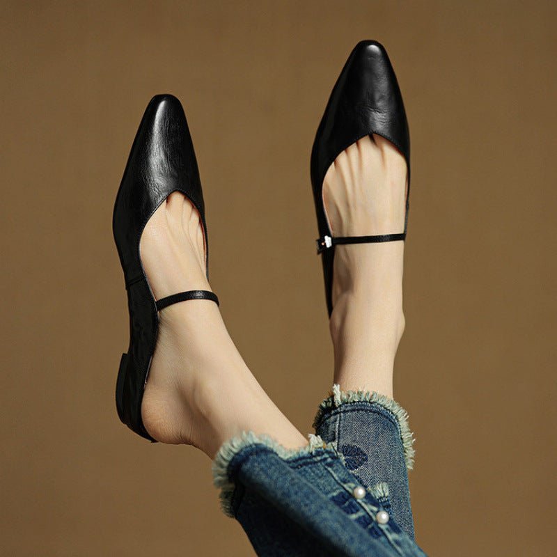 Women's black leather flats featuring a buckle strap and pointed-toe slip-on Mary Jane design, perfect for stylish and comfortable everyday wear. 2