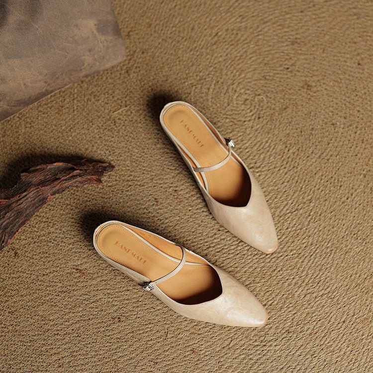 Women's black leather flats featuring a buckle strap and pointed-toe slip-on Mary Jane design, perfect for stylish and comfortable everyday wear. 6