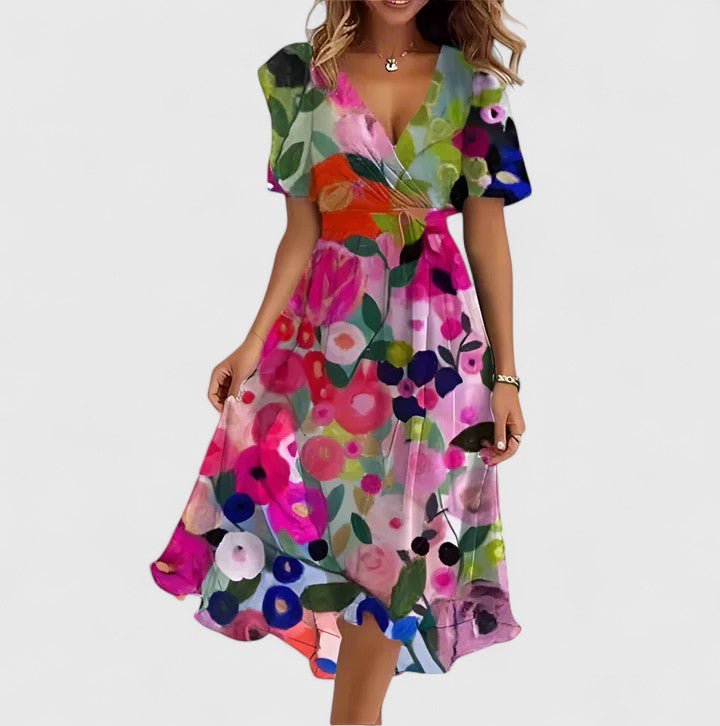 Women's floral dress featuring a high-low hem and flutter sleeves, perfect for elegant summer garden parties. 3