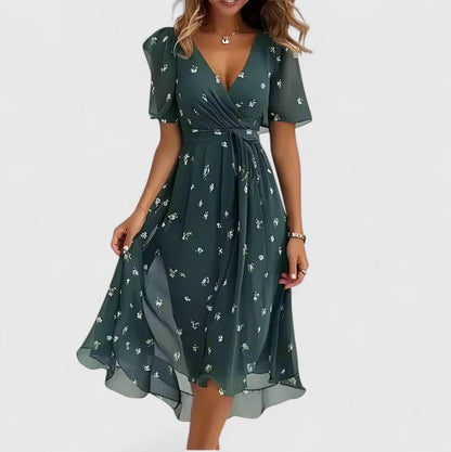 Women's floral dress featuring a high-low hem and flutter sleeves, perfect for elegant summer garden parties. 6