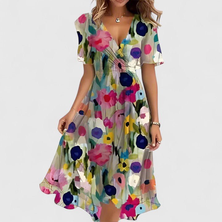 Women's floral dress featuring a high-low hem and flutter sleeves, perfect for elegant summer garden parties. 2