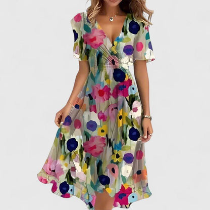 Women's floral dress featuring a high-low hem and flutter sleeves, perfect for elegant summer garden parties. 2