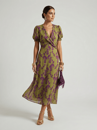 Womens floral midi dress featuring a wrap bodice and short sleeves, perfect for summer, made from lightweight fabric for comfort and style. 0
