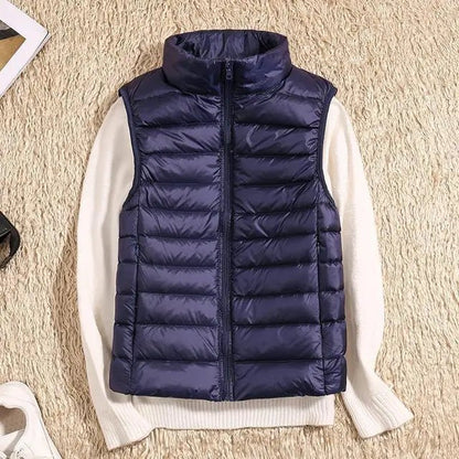 Lightweight women's gilet featuring windproof protection and a fitted design, perfect for layering and outdoor activities. 11