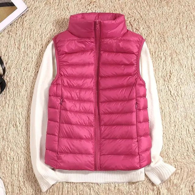 Lightweight women's gilet featuring windproof protection and a fitted design, perfect for layering and outdoor activities. 10