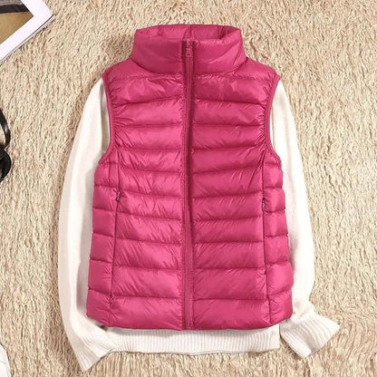Lightweight women's gilet featuring windproof protection and a fitted design, perfect for layering and outdoor activities. 10