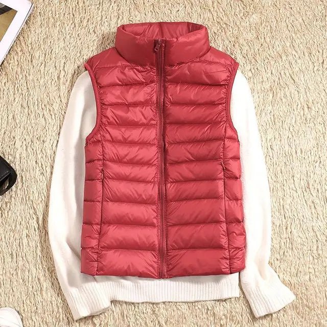 Lightweight women's gilet featuring windproof protection and a fitted design, perfect for layering and outdoor activities. 6