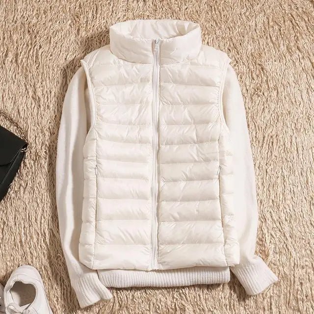 Lightweight women's gilet featuring windproof protection and a fitted design, perfect for layering and outdoor activities. 7