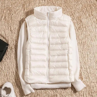 Lightweight women's gilet featuring windproof protection and a fitted design, perfect for layering and outdoor activities. 7