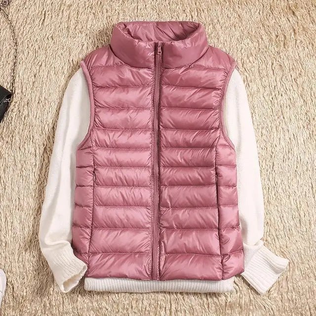 Lightweight women's gilet featuring windproof protection and a fitted design, perfect for layering and outdoor activities. 5