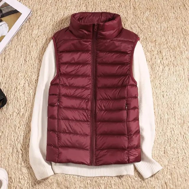 Lightweight women's gilet featuring windproof protection and a fitted design, perfect for layering and outdoor activities. 8