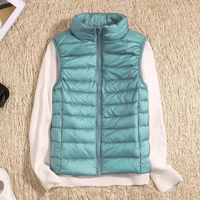 Lightweight women's gilet featuring windproof protection and a fitted design, perfect for layering and outdoor activities. 2