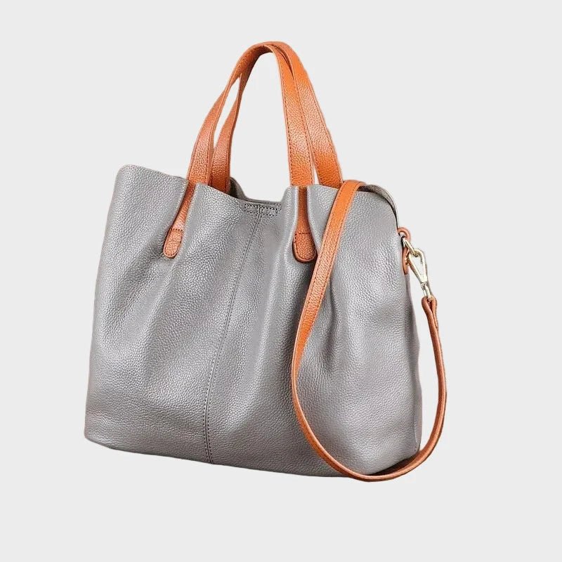 Women's genuine cowhide leather handbag with adjustable strap, featuring a spacious design ideal for everyday use. 6
