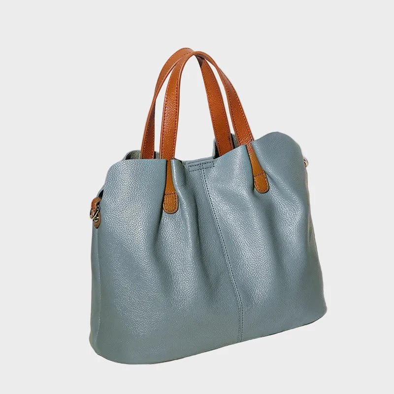 Women's genuine cowhide leather handbag with adjustable strap, featuring a spacious design ideal for everyday use. 7