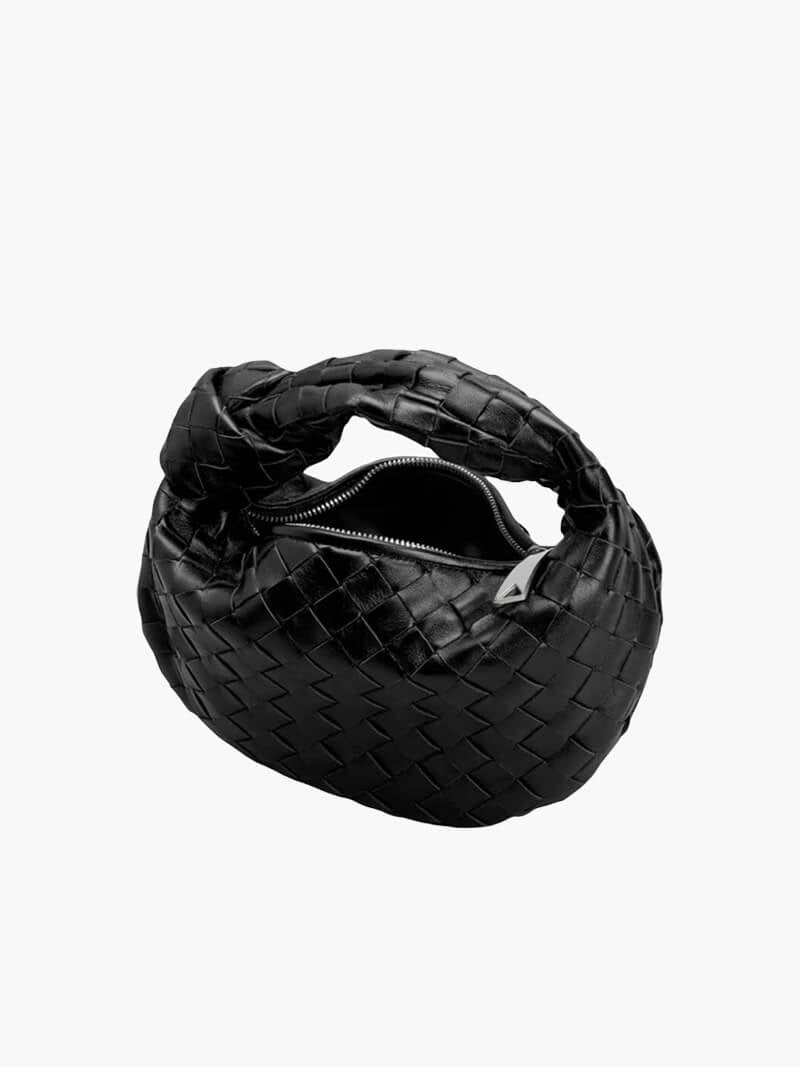 Women's vegan leather handbag featuring a stylish woven grid design, perfect for adding elegance and practicality to any outfit or occasion. 1