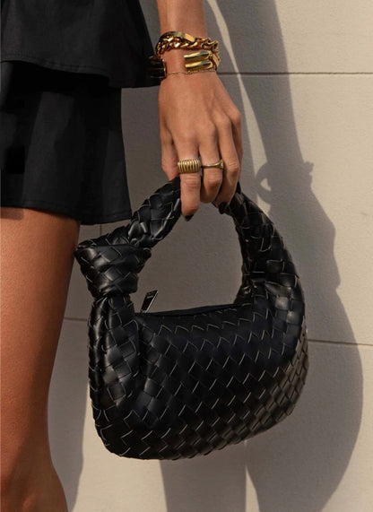Women's vegan leather handbag featuring a stylish woven grid design, perfect for adding elegance and practicality to any outfit or occasion. 4
