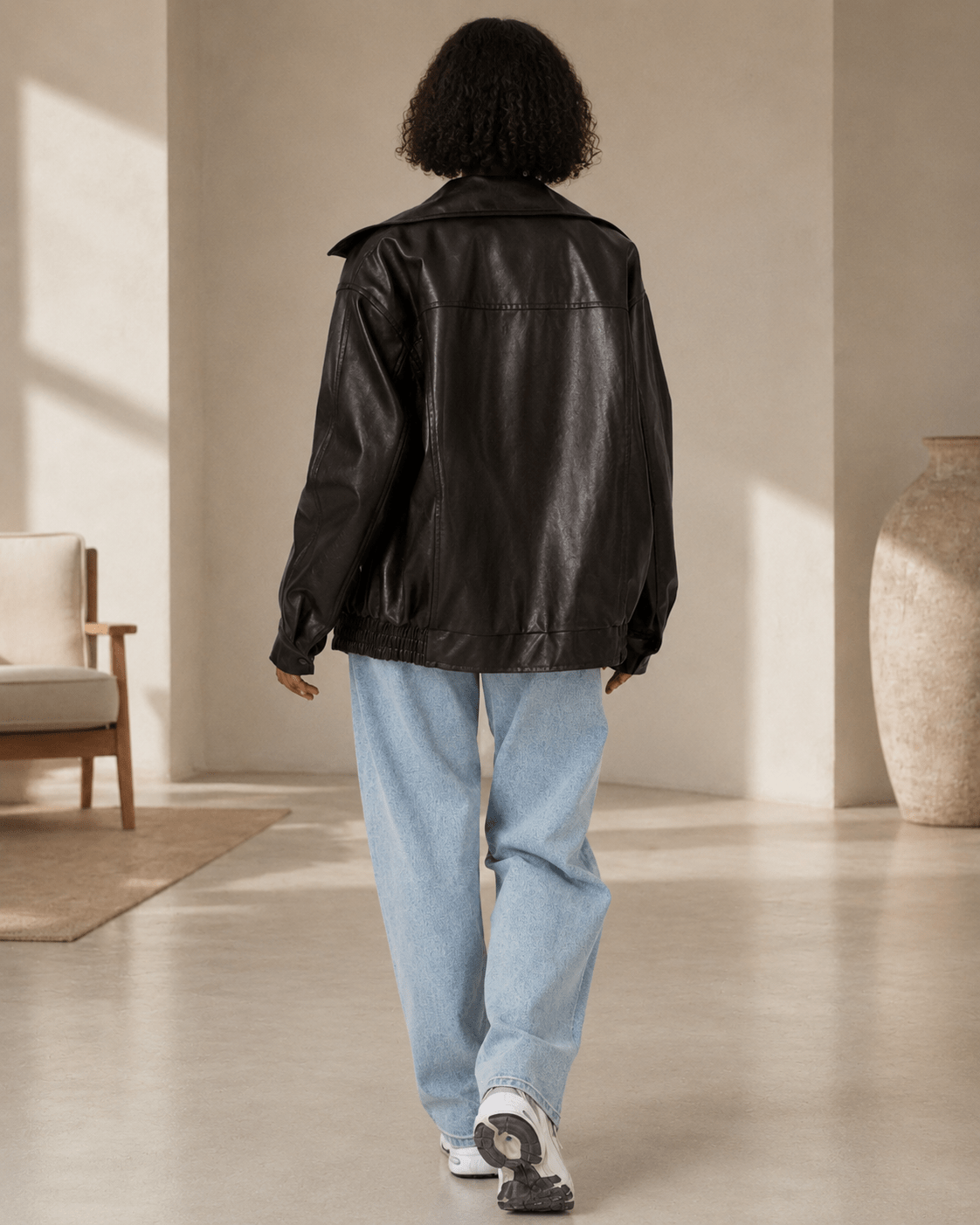 Women's oversized fit leather look jacket, perfect for casual everyday wear, featuring stylish design and comfortable fit. 2