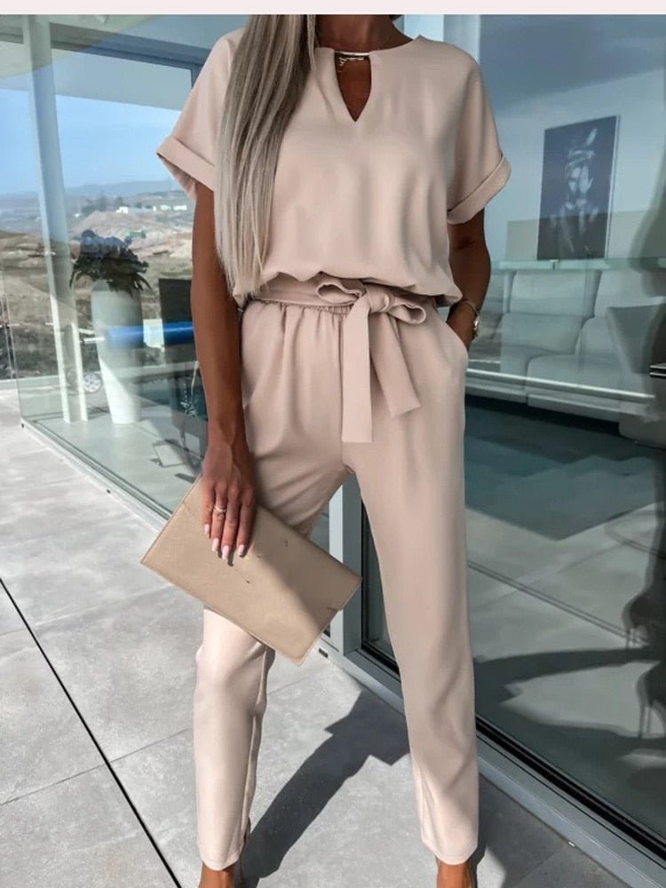 Women's elegant black jumpsuit featuring a flattering V-neckline and comfortable elastic waistband, perfect for transitioning from day to night. 7