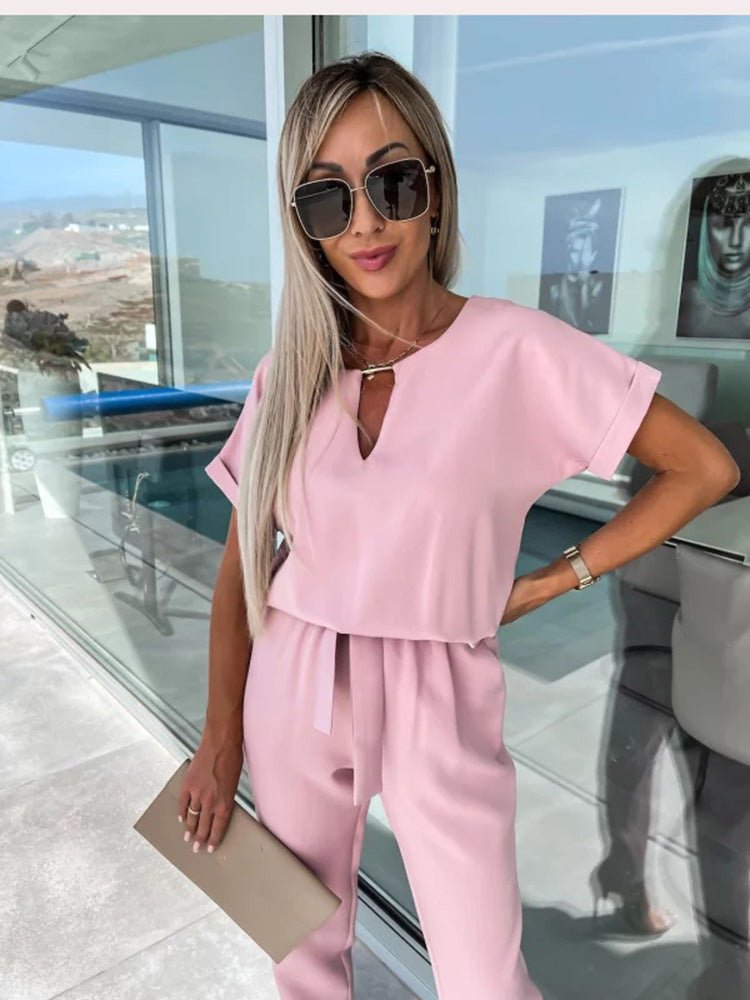 Women's elegant black jumpsuit featuring a flattering V-neckline and comfortable elastic waistband, perfect for transitioning from day to night. 5