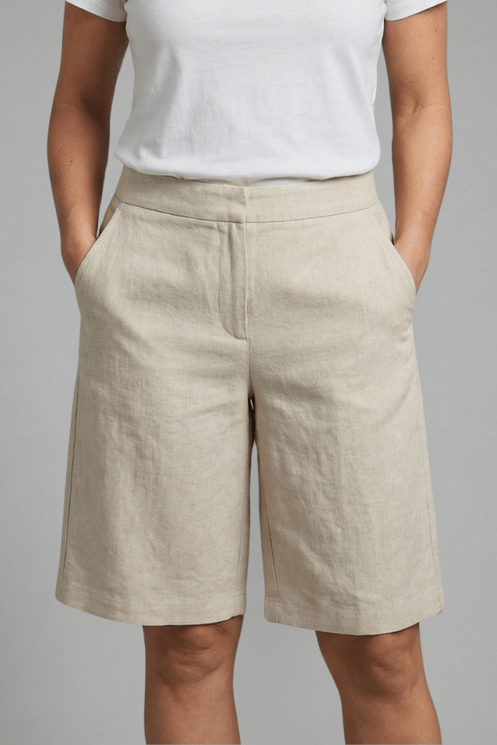Women's knee-length casual shorts featuring an adjustable waistband and practical pockets, made from comfortable lightweight fabric perfect for warm weather. 0