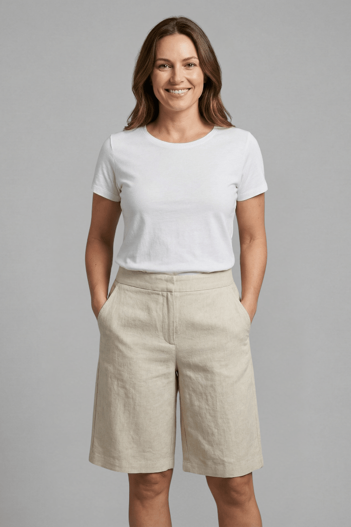 Women's knee-length casual shorts featuring an adjustable waistband and practical pockets, made from comfortable lightweight fabric perfect for warm weather. 2