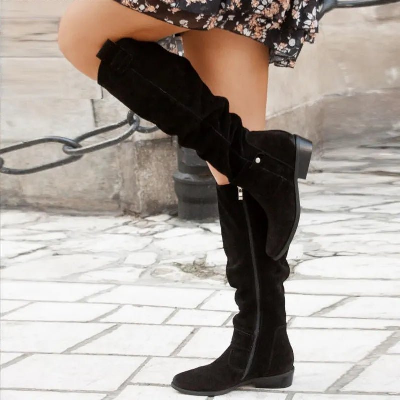 Women's leather boots featuring an elegant design, perfect for versatile everyday and formal wear, showcasing timeless style and sophistication. 1