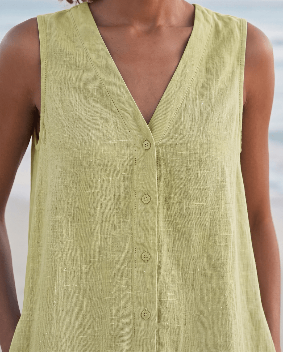 Women's linen midi dress featuring a stylish V-neck and a tiered skirt, perfect for casual beach wear in warm summer days. 8