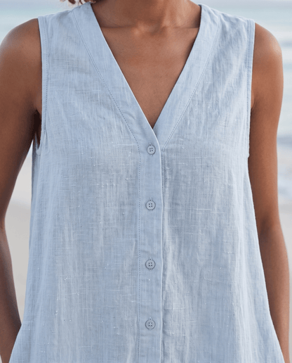 Women's linen midi dress featuring a stylish V-neck and a tiered skirt, perfect for casual beach wear in warm summer days. 2