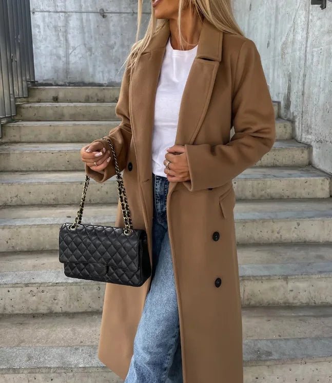 Women's long wool coat featuring a double-breasted design, elegant structured silhouette, and crafted from high-quality wool for stylish warmth and comfort. 6