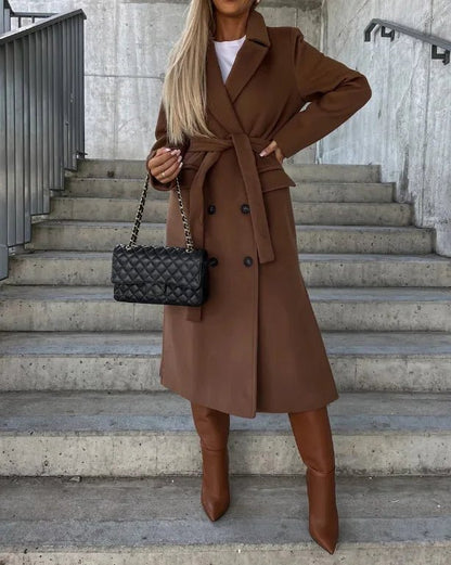 Women's long wool coat featuring a double-breasted design, elegant structured silhouette, and crafted from high-quality wool for stylish warmth and comfort. 4