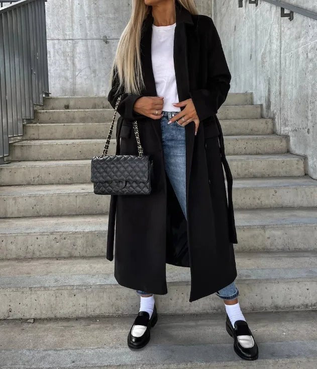 Women's long wool coat featuring a double-breasted design, elegant structured silhouette, and crafted from high-quality wool for stylish warmth and comfort. 5