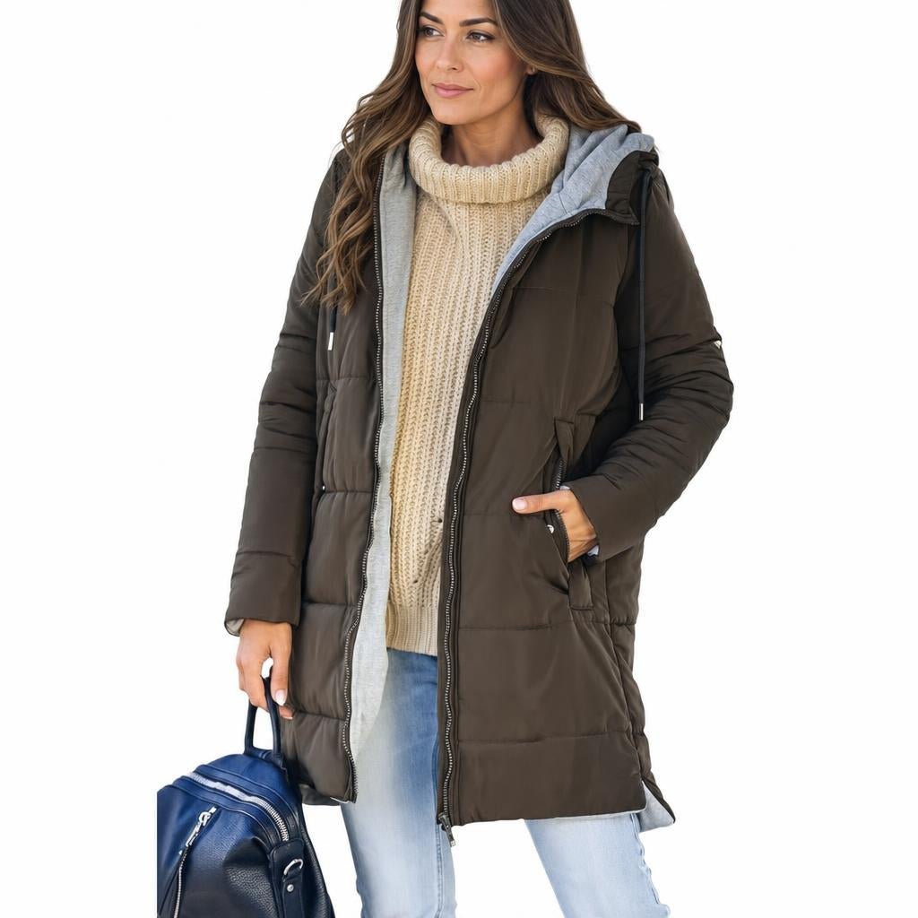 Women's longline quilted puffer jacket in black, featuring a zip front and practical pockets, ideal for cold weather wear. 6