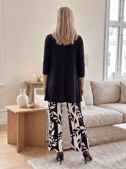 Women's loungewear set featuring a longline top and printed trousers, crafted from soft breathable fabric for ultimate casual comfort. 1