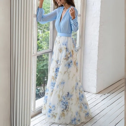 Women's maxi dress featuring an elegant V-neck design, floral motifs, and flowing sleeves, ideal for summer outings and formal occasions. 2