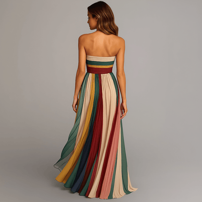 Plus size women's maxi dress featuring a vibrant, colorful strapless design with elegant pleats, perfect for summer occasions. 3